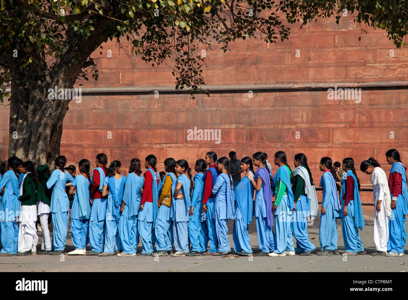 Muslim teenager girls wearing blue school uniforms in Old Delhi, India Stock Photo