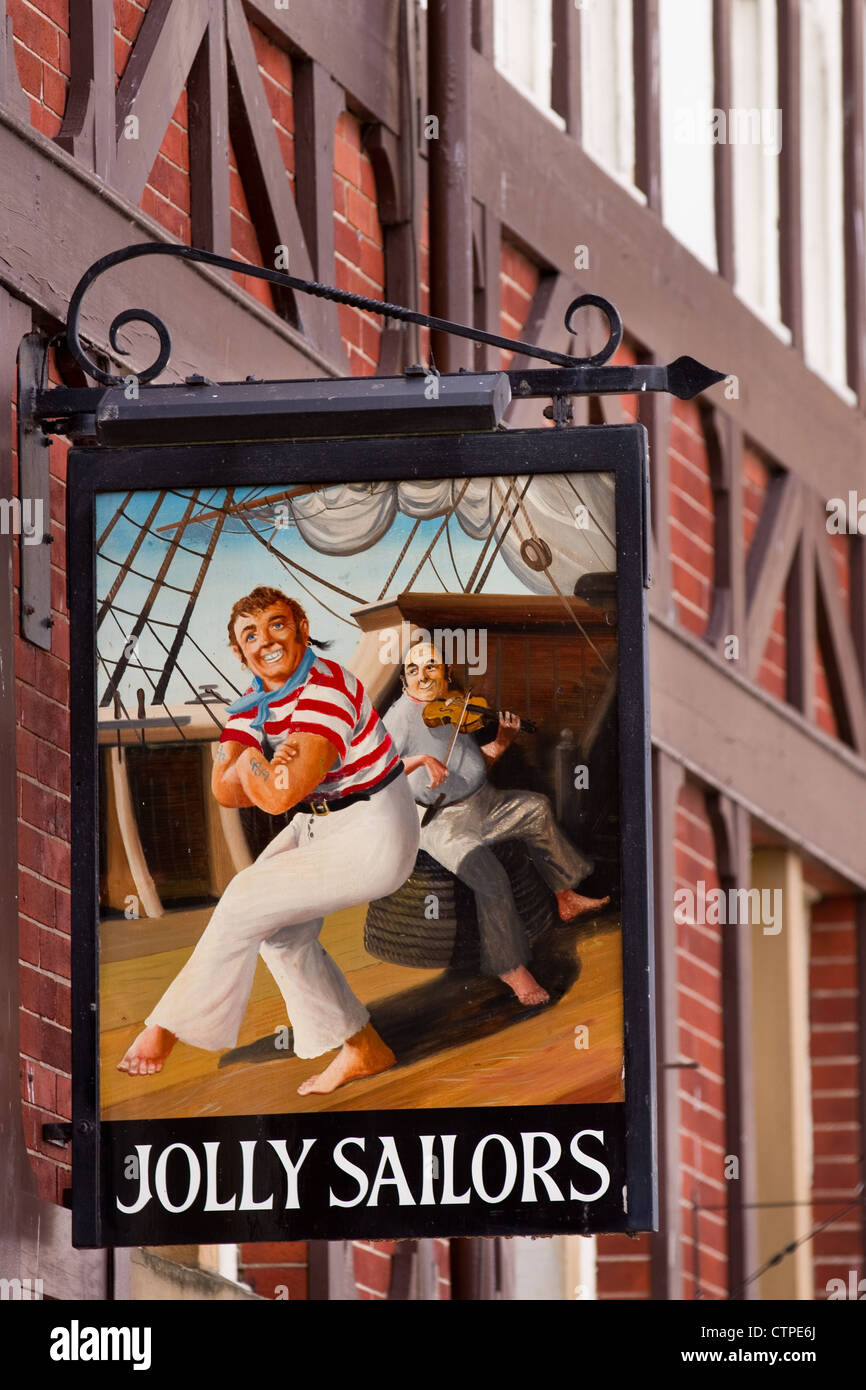Musical Jolly Sailors, dancing hornpipe to violinist, Seafaring maritime pub sign in Whitby, a coastal town in North Yorkshire, UK Stock Photo