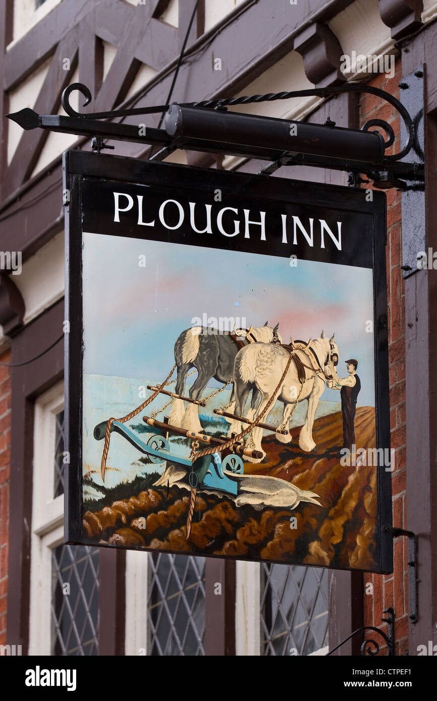 The Plough Inn; Painted metal Pub sign of horse ploughing field; Whitby a coastal town in North Yorkshire, UK Stock Photo