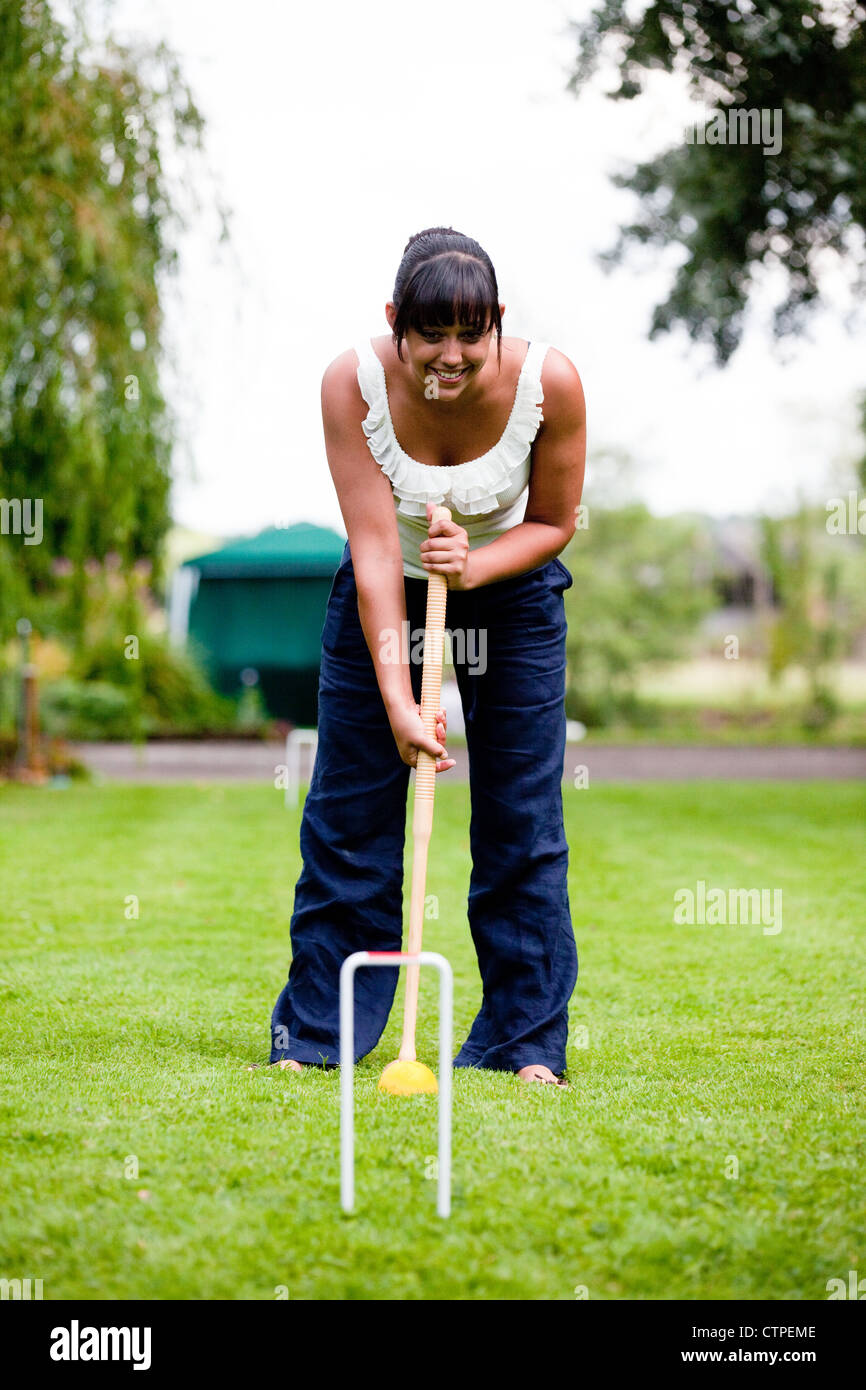 Teenage girl playing croquet, UK Stock Photo Alamy