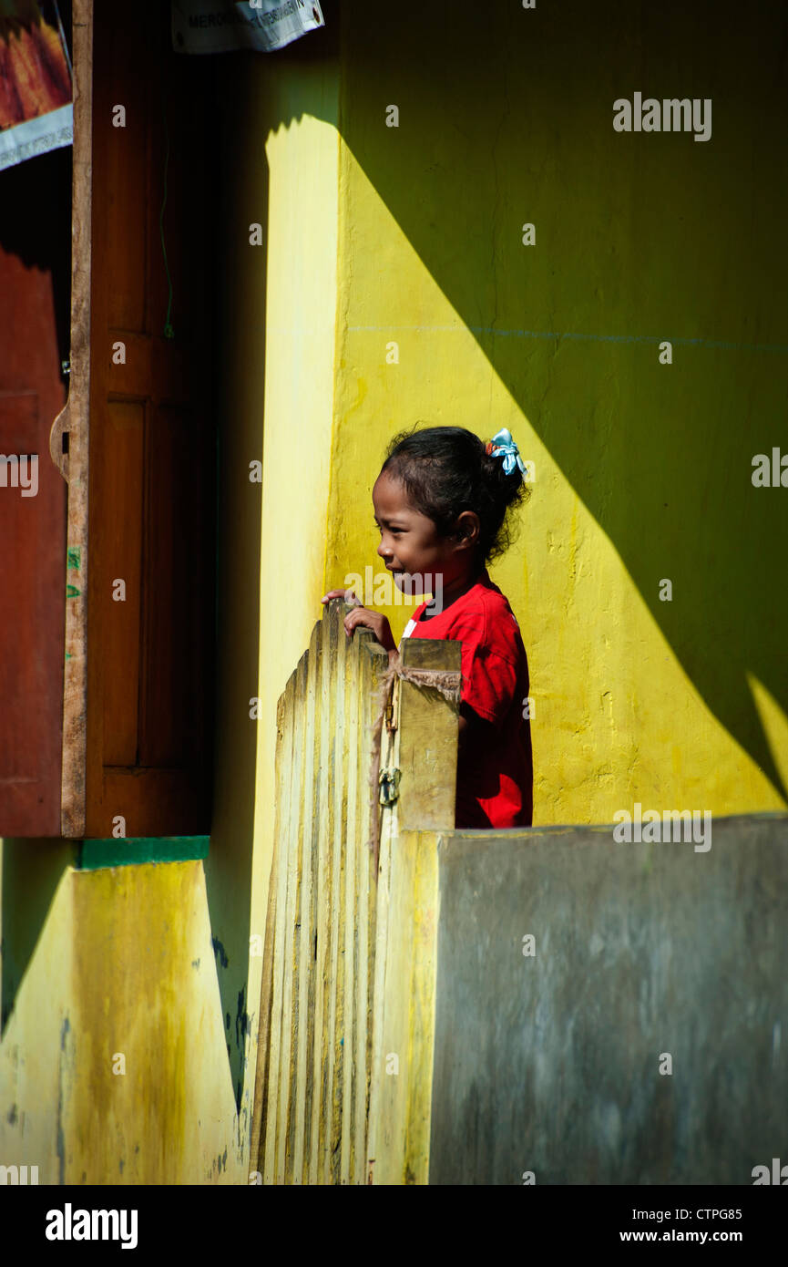 Even though Komodo Island seems like a poor community, the children all seem to enjoy posing for photographs and are happy. Stock Photo