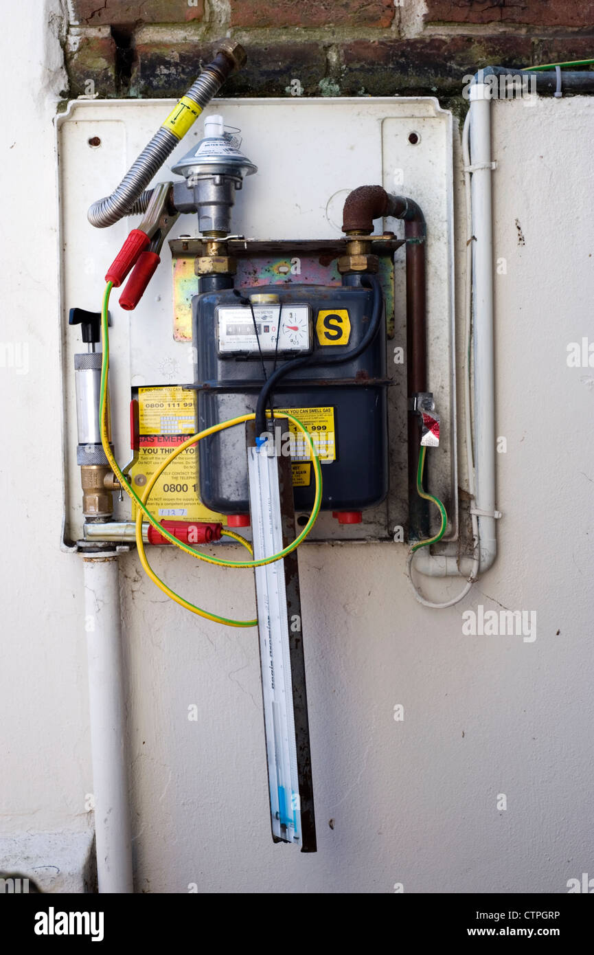 service and repairs for a domestic gas meter Stock Photo Alamy