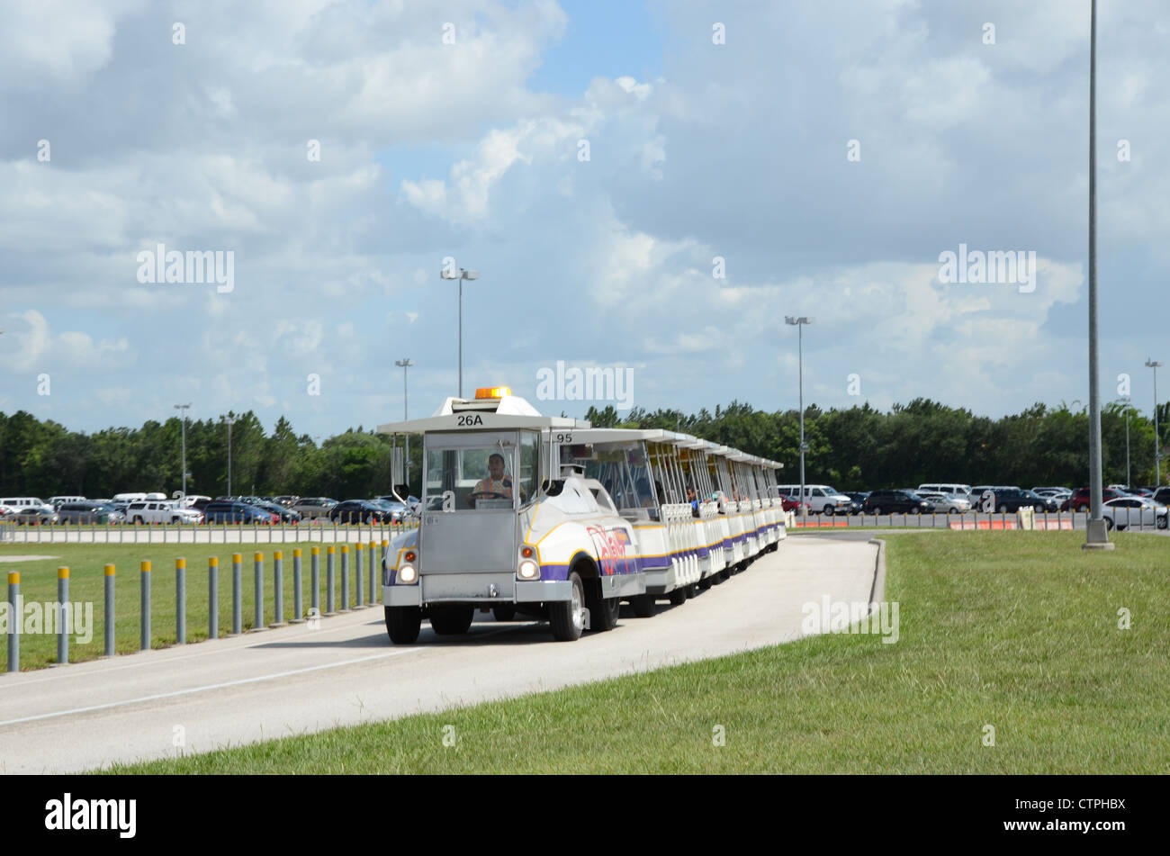 Disney Tram servicing the car park areas at Disney Florida. The tram collects and returns customer to and from the parking areas Stock Photo