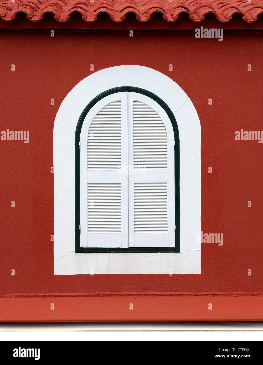 white shuttered window abstract red painted building Stock Photo - Alamy