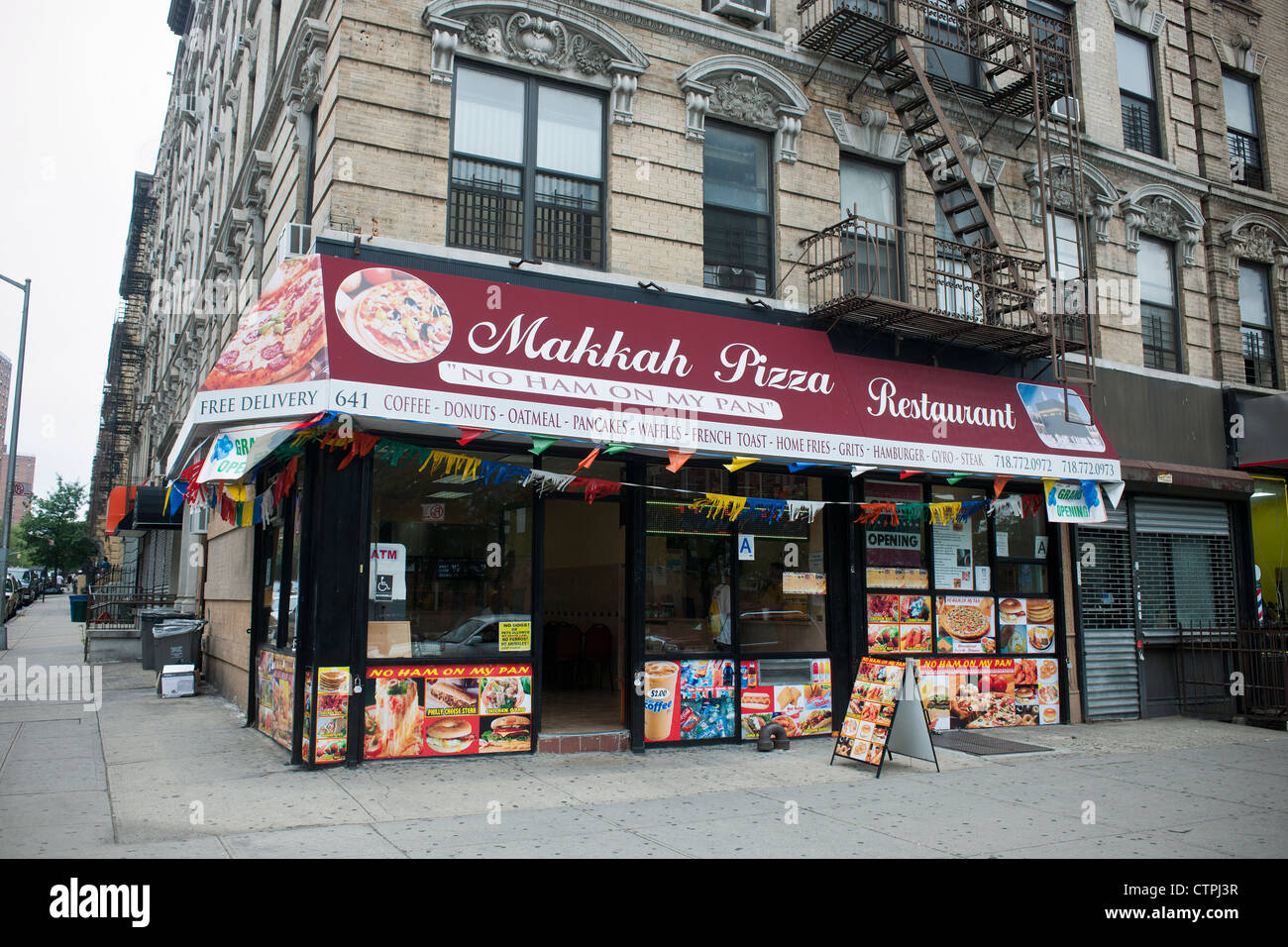 Makkah Pizza in Harlem in New York proudly proclaims "No Ham On My Pan" on its advertising Stock Photo