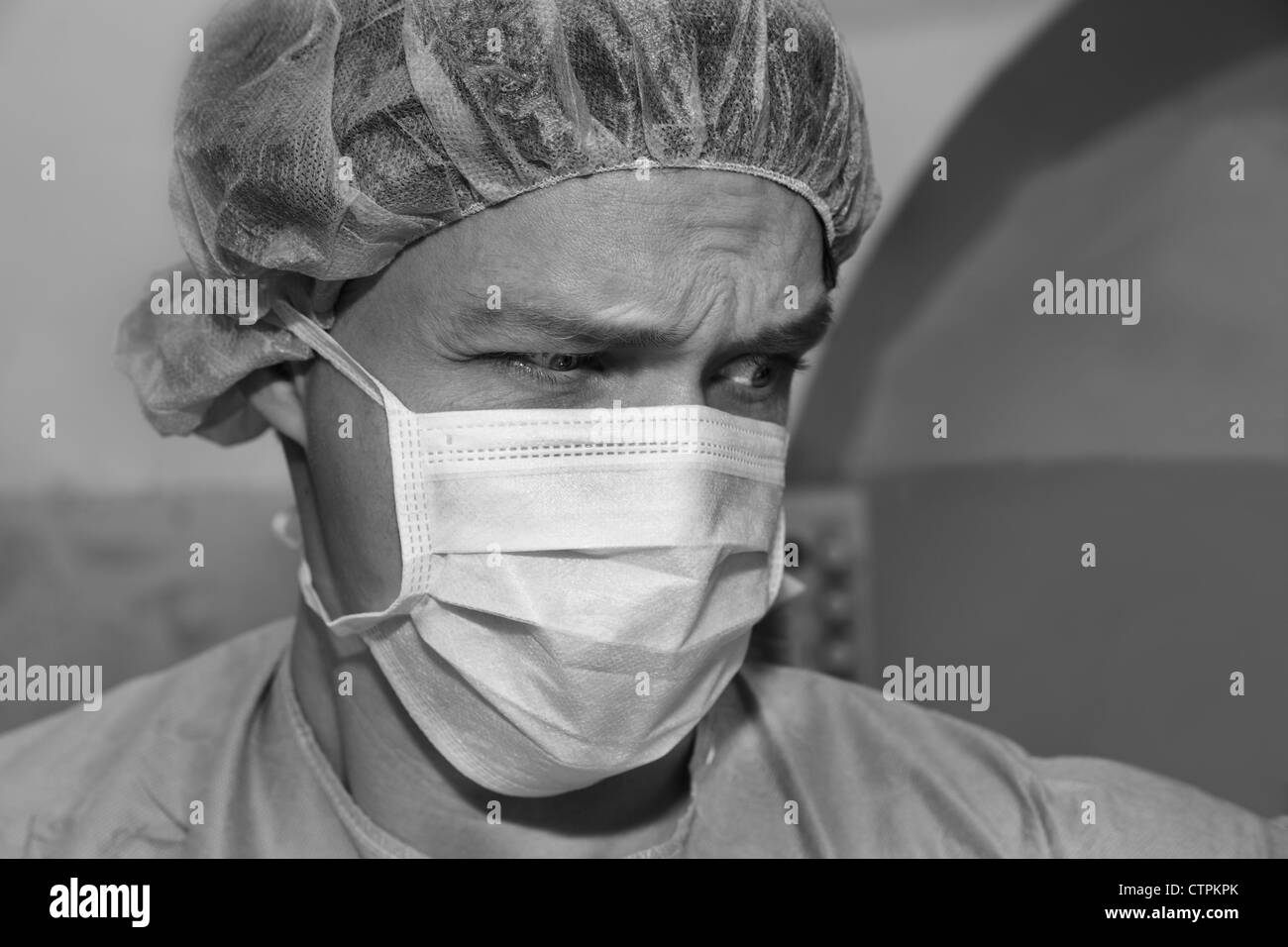 Shaded surgeon have thoughts about coming difficult surgery Stock Photo