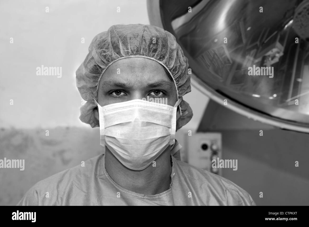 Shaded surgeon seems serious about coming difficult surgery Stock Photo