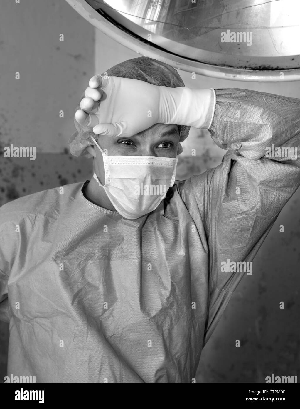 Shaded surgeon is tired and happy saving live Stock Photo