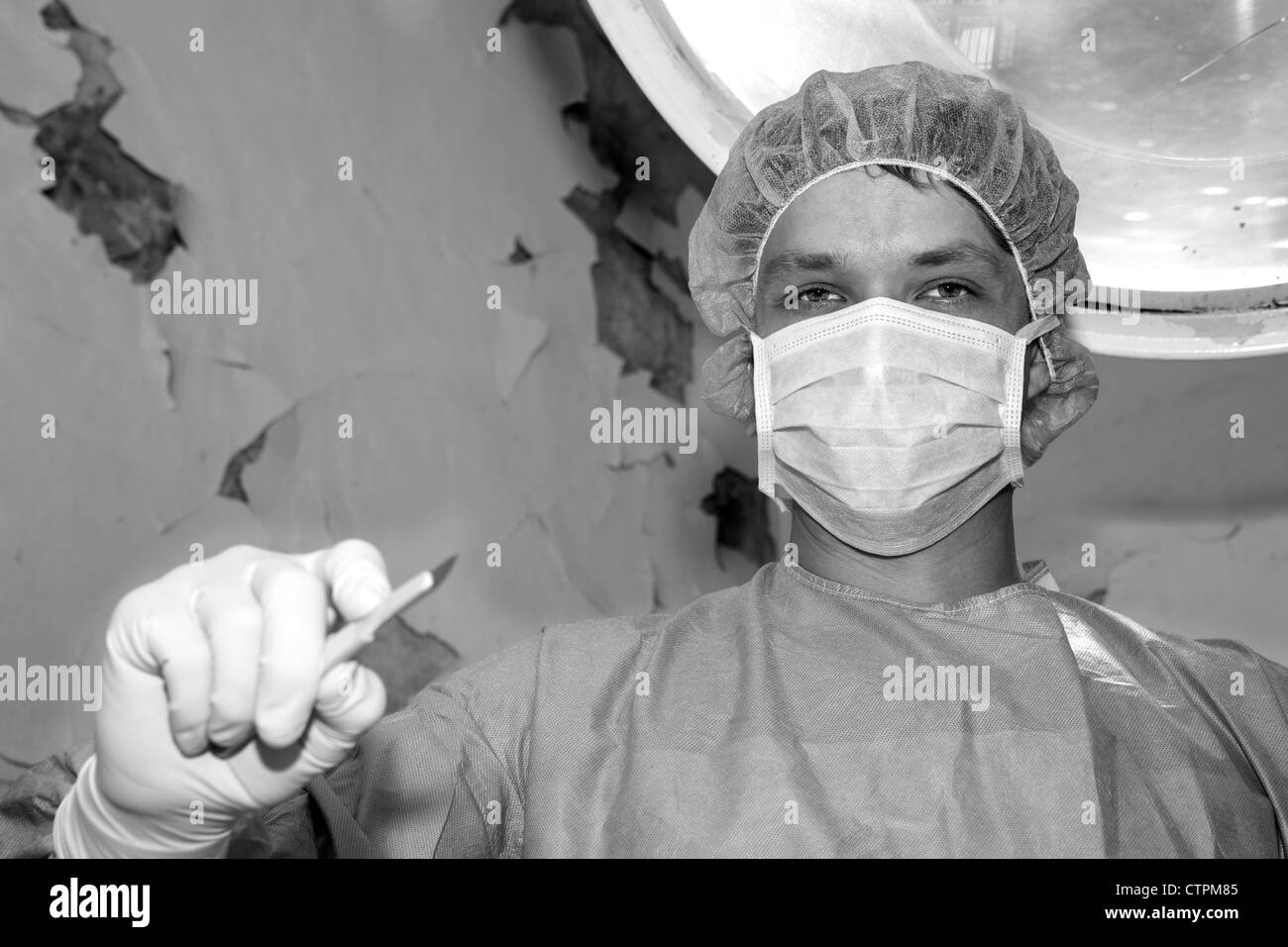 Shaded surgeon have look before coming difficult surgery Stock Photo
