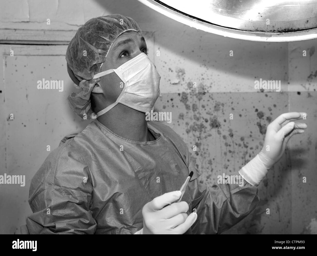Shaded surgeon ask god before coming difficult surgery Stock Photo
