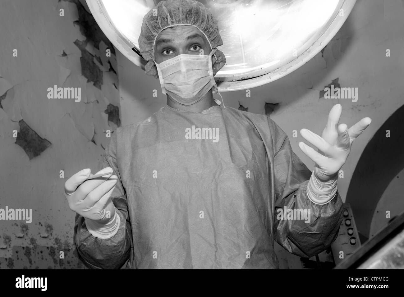 Shaded surgeon ask camera before coming difficult surgery Stock Photo