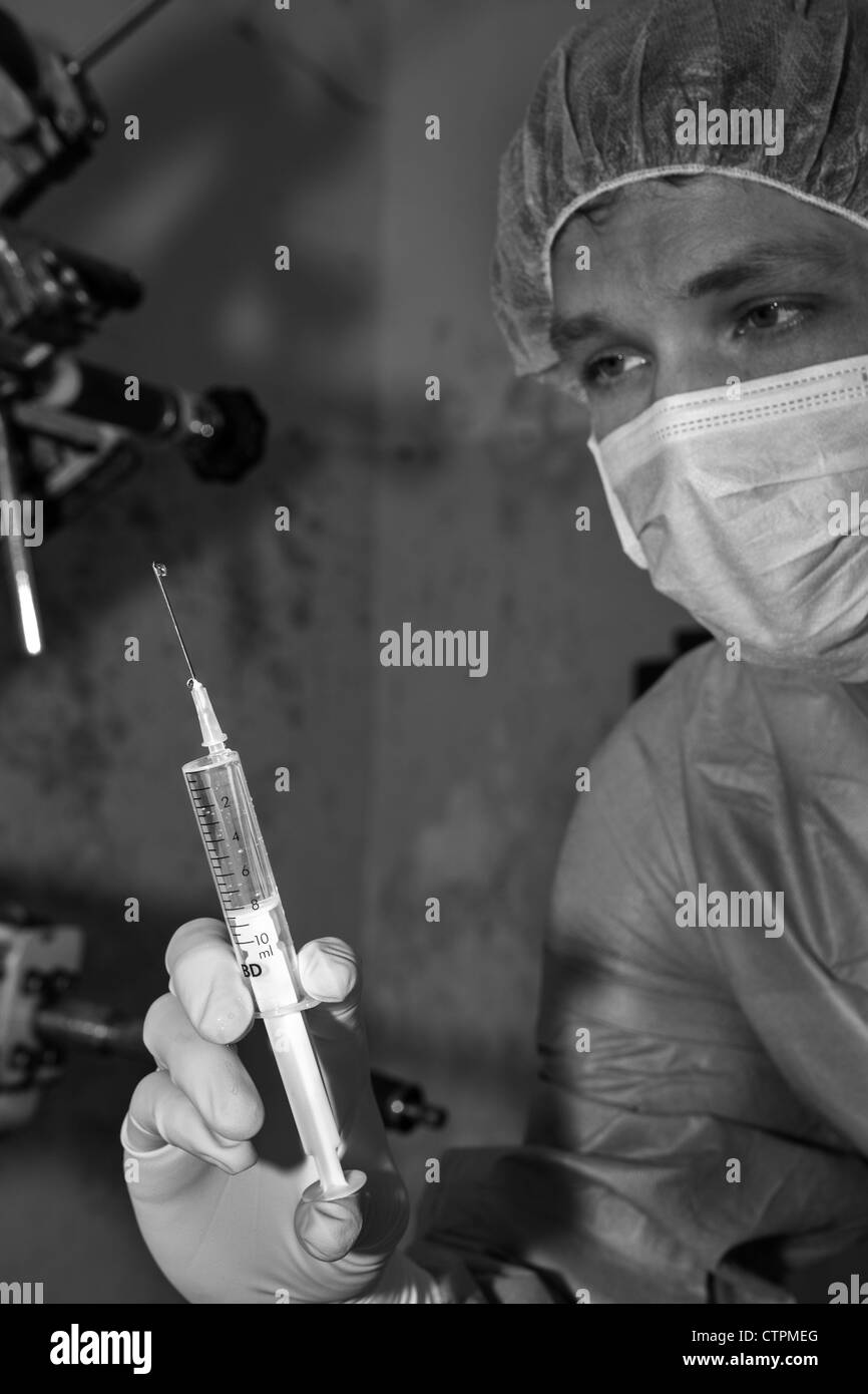 Shaded surgeon prepare make injection coming difficult surgery Stock Photo