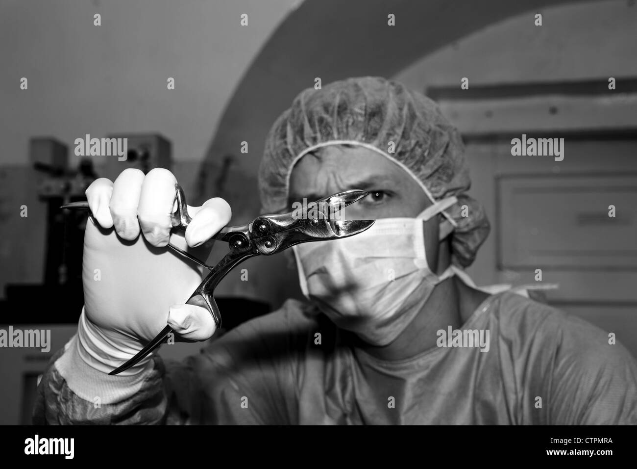 Surgeon show strange tool before coming difficult surgery Stock Photo