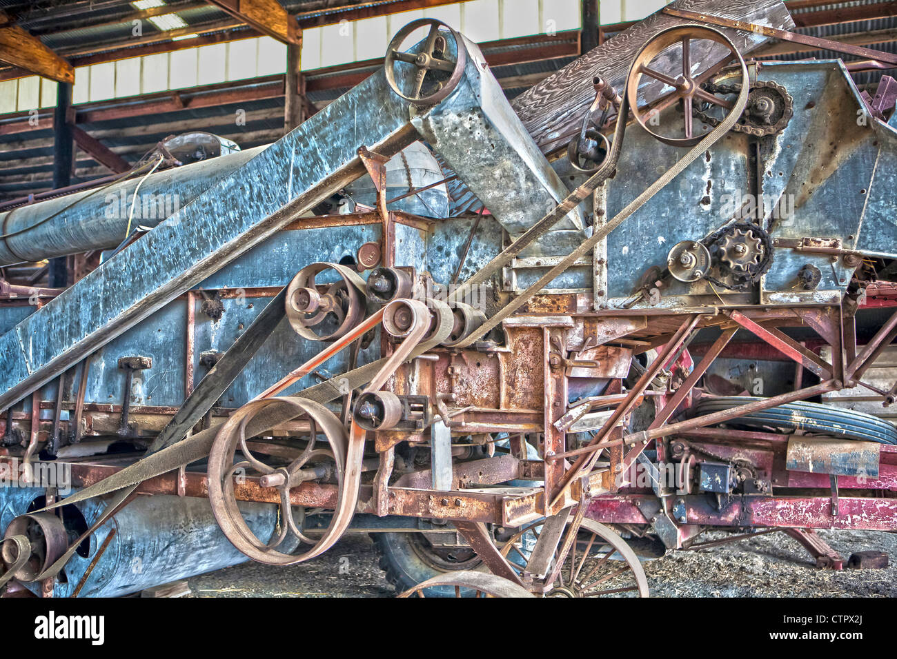 belt drives on antique farm harvesting equipment Stock Photo 49675882