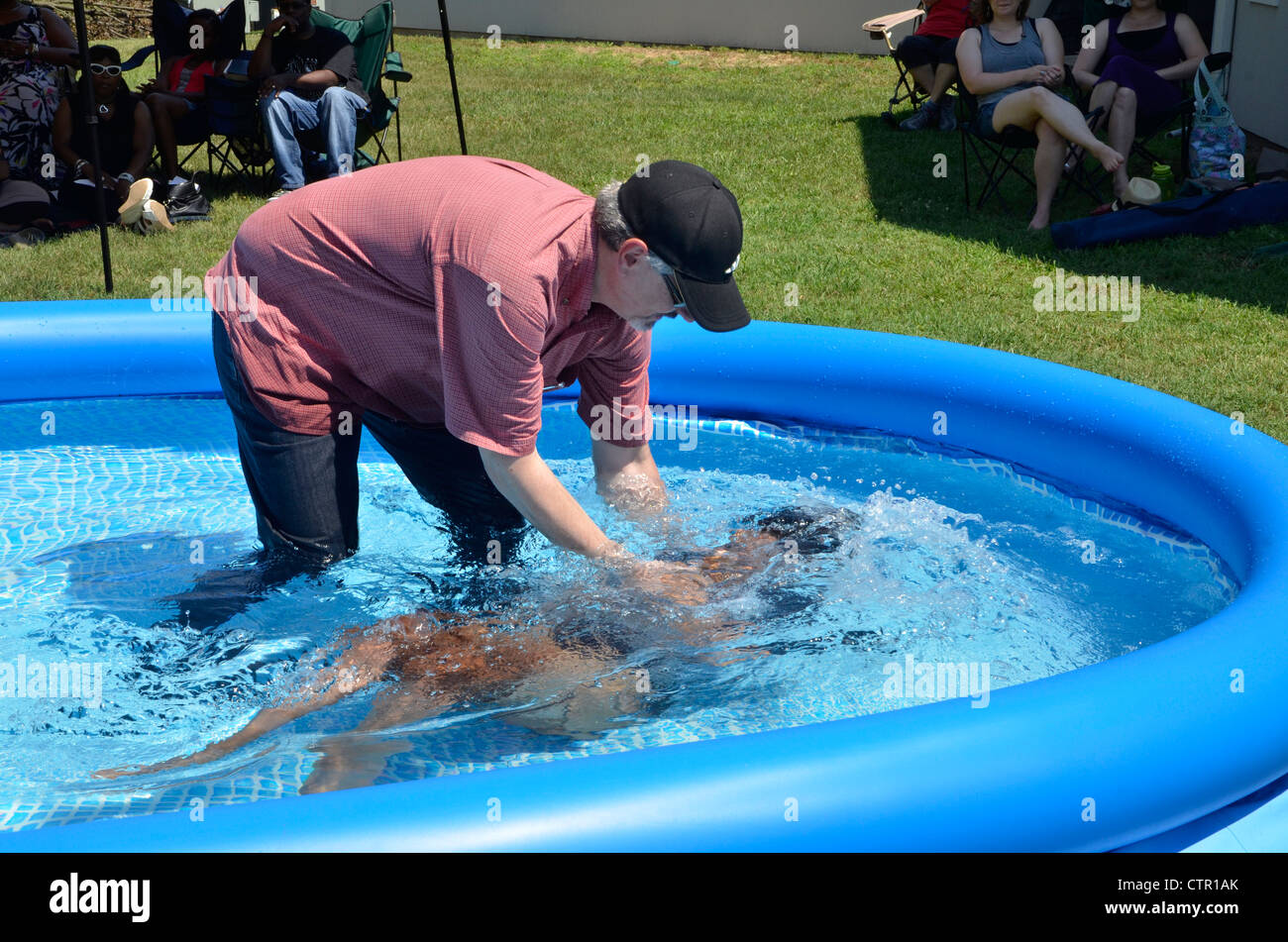 Female pastor baptism hi-res stock photography and images - Alamy