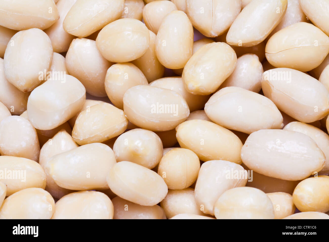 Macro shot of peeled off peanuts. Stock Photo
