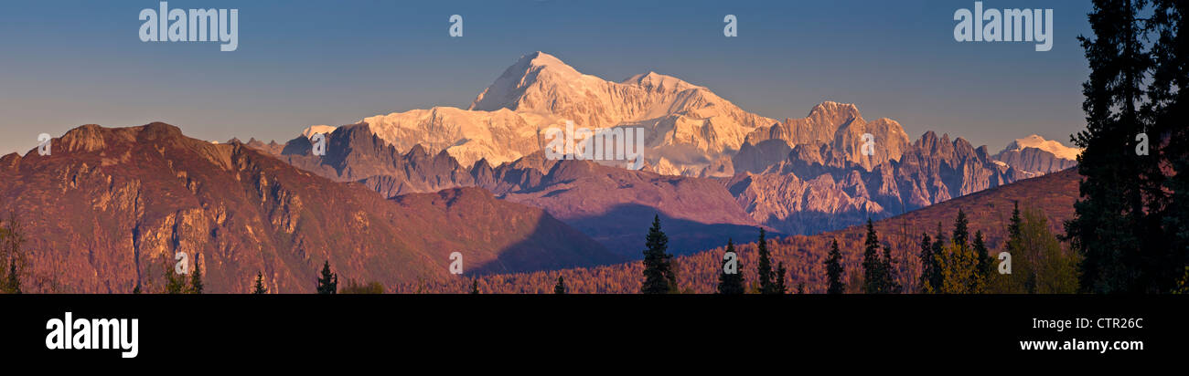 Panorama scenic sunrise on Mt McKinley Alaska Range as seen Veterans Memorial in Denali State Park Southcentral Alaska Autumn Stock Photo