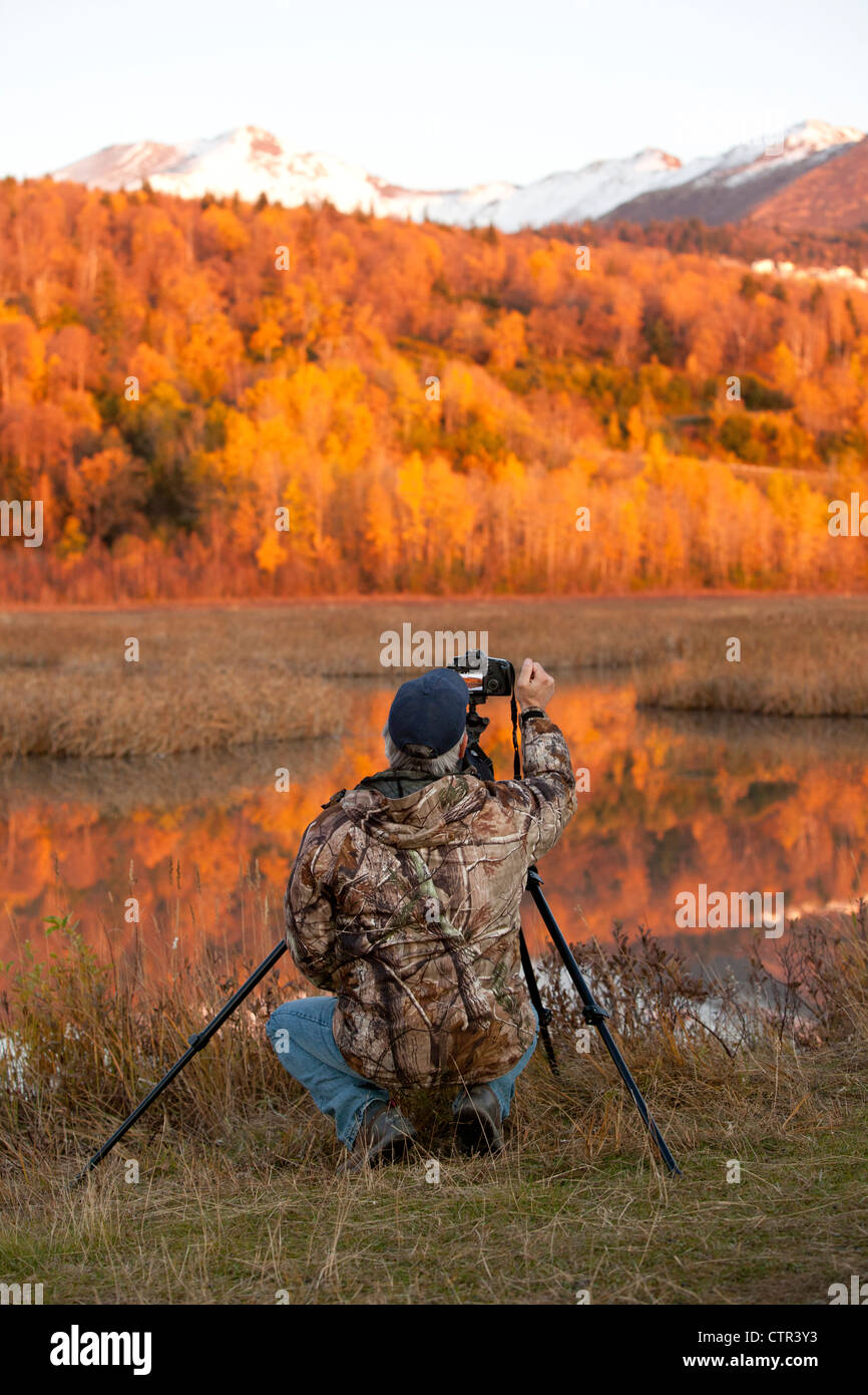 Photographer at Potter Marsh at sunset, Southcentral Alaska, Autumn Stock Photo