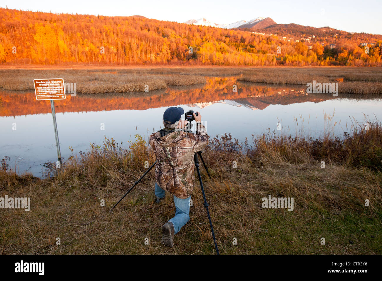 Photographer at Potter Marsh at sunset, Southcentral Alaska, Autumn Stock Photo
