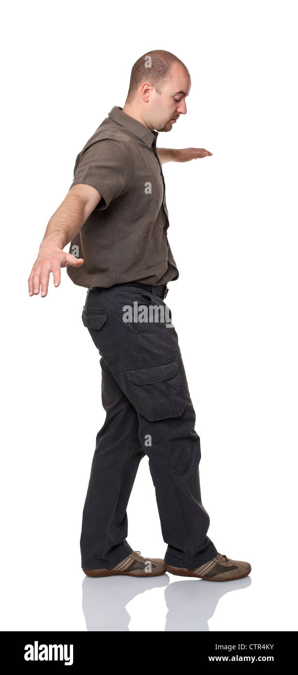 man balance himself on white background Stock Photo
