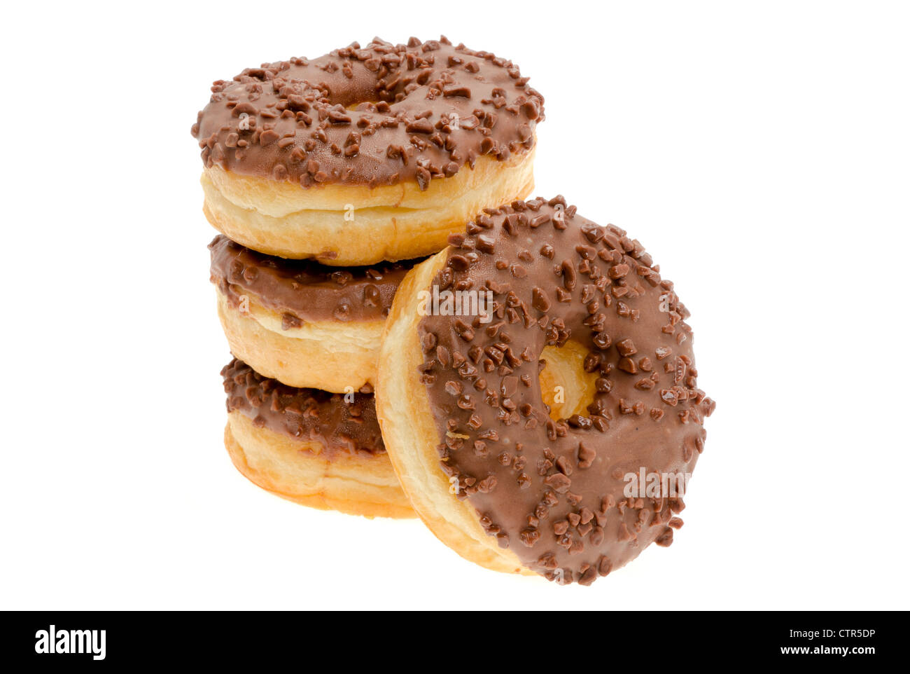 Close-up on some chocolate chip iced ring donuts. Studio shot. Stock Photo