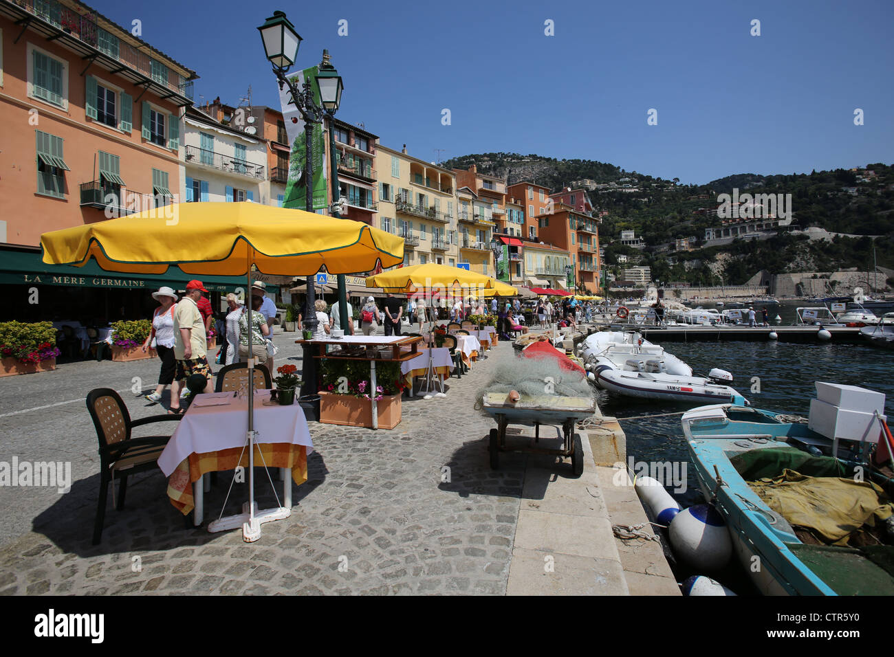 Town of Villefranche, France. Picturesque summer view of tables set for ...