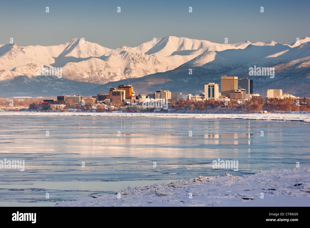 View of Anchorage skyline, Chugach Mountains and Cook Inlet from Earthquake Park, Southcentral Alaska, Winter Stock Photo