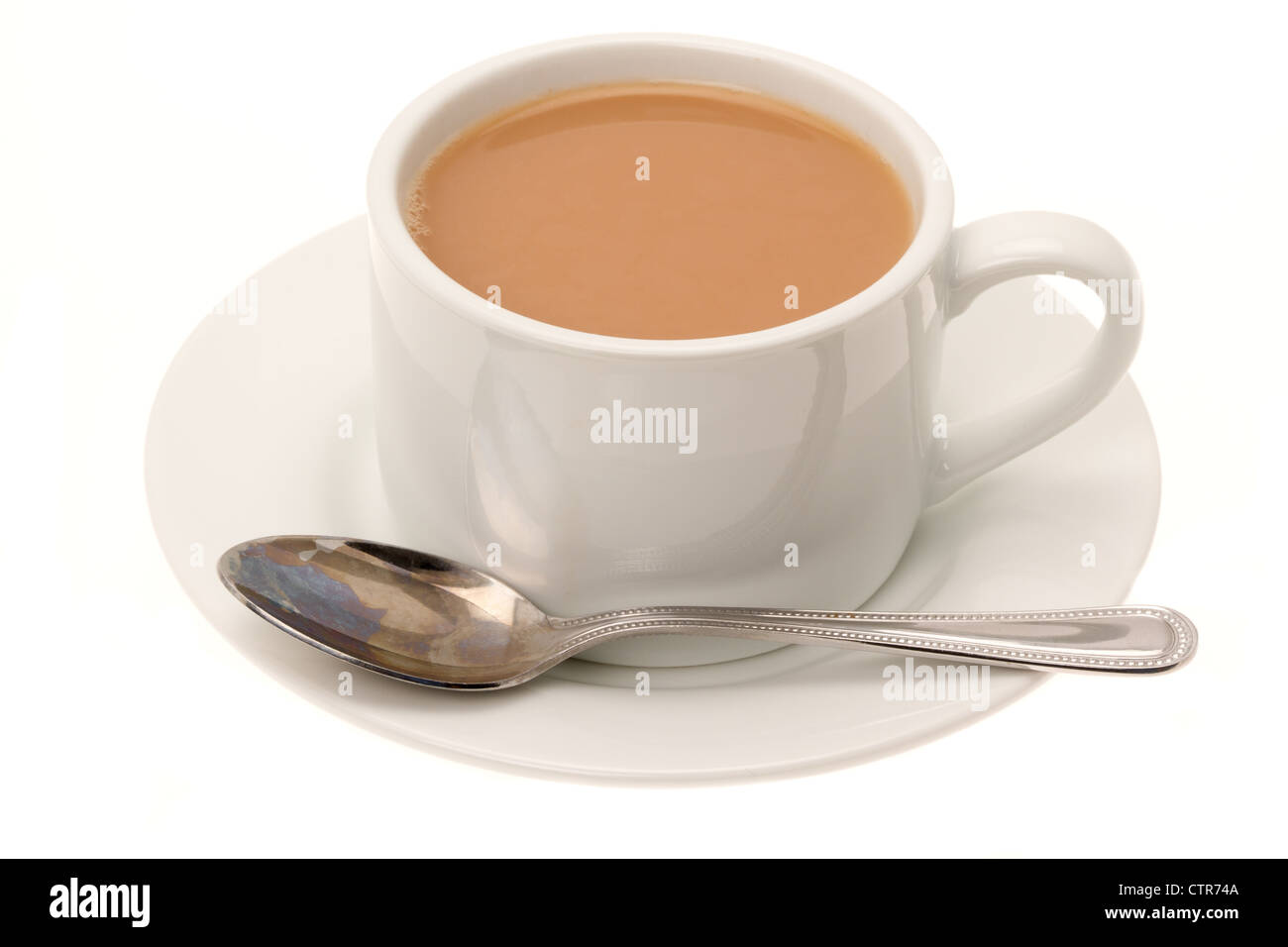 White china cup and saucer containing a drink of hot tea. Stock Photo