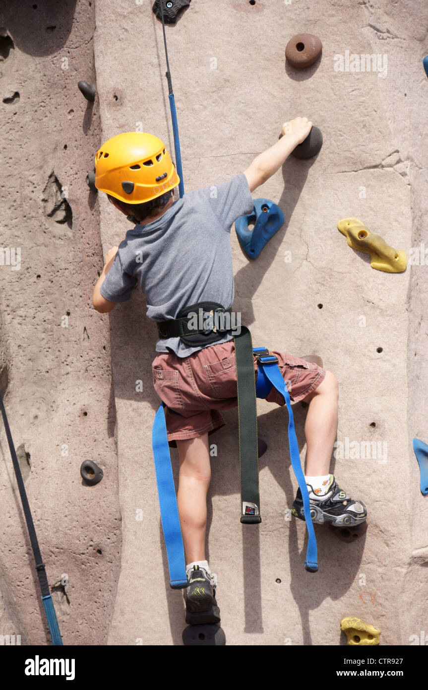 child kid rock climbing indoor sport children kids boy climb guy junior lad schoolboy youngster youth crawling Stock Photo