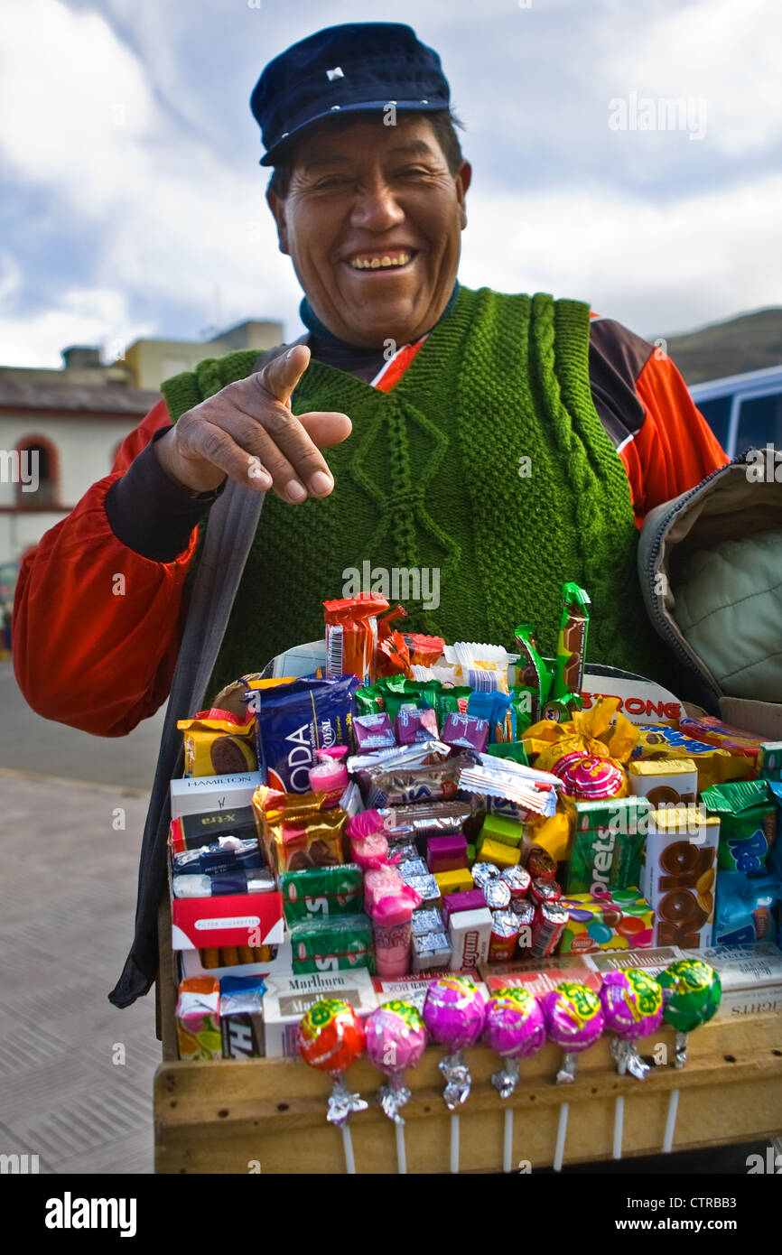 Man selling candies on the streets at Puno, Peru Stock Photo - Alamy