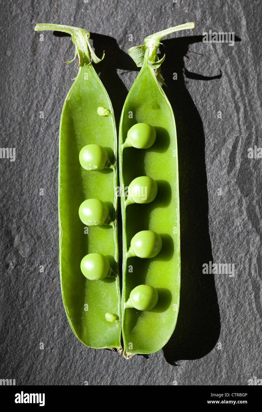 Fresh peas in their pods Stock Photo