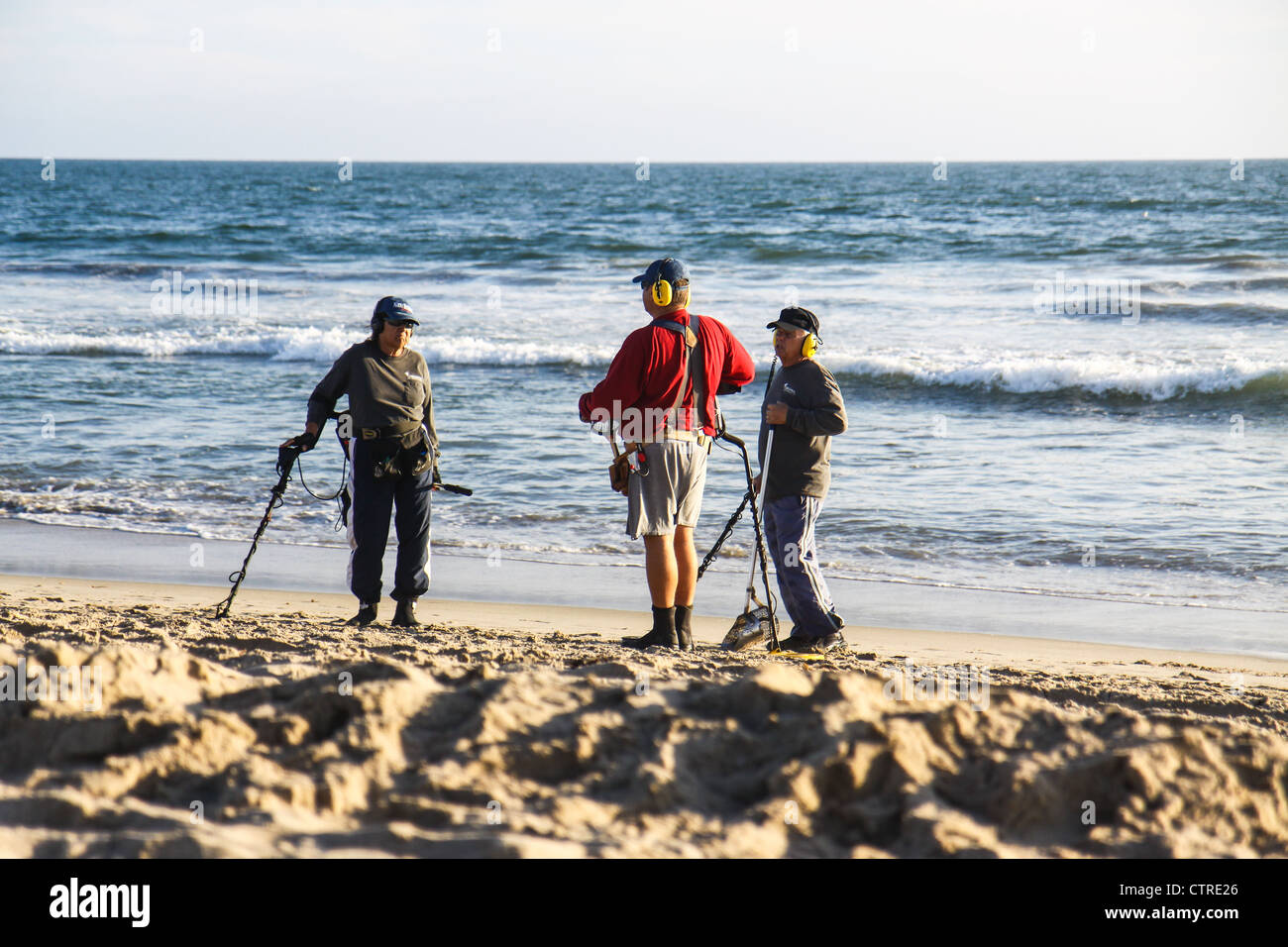 Beach metal detecting Stock Photo Alamy