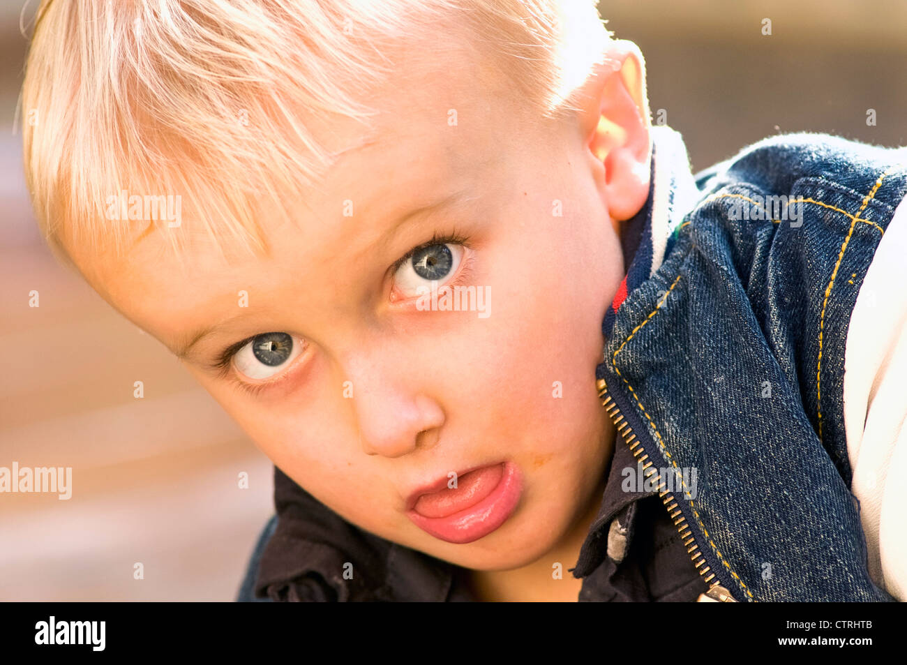 Little boy looking at the camera Stock Photo - Alamy