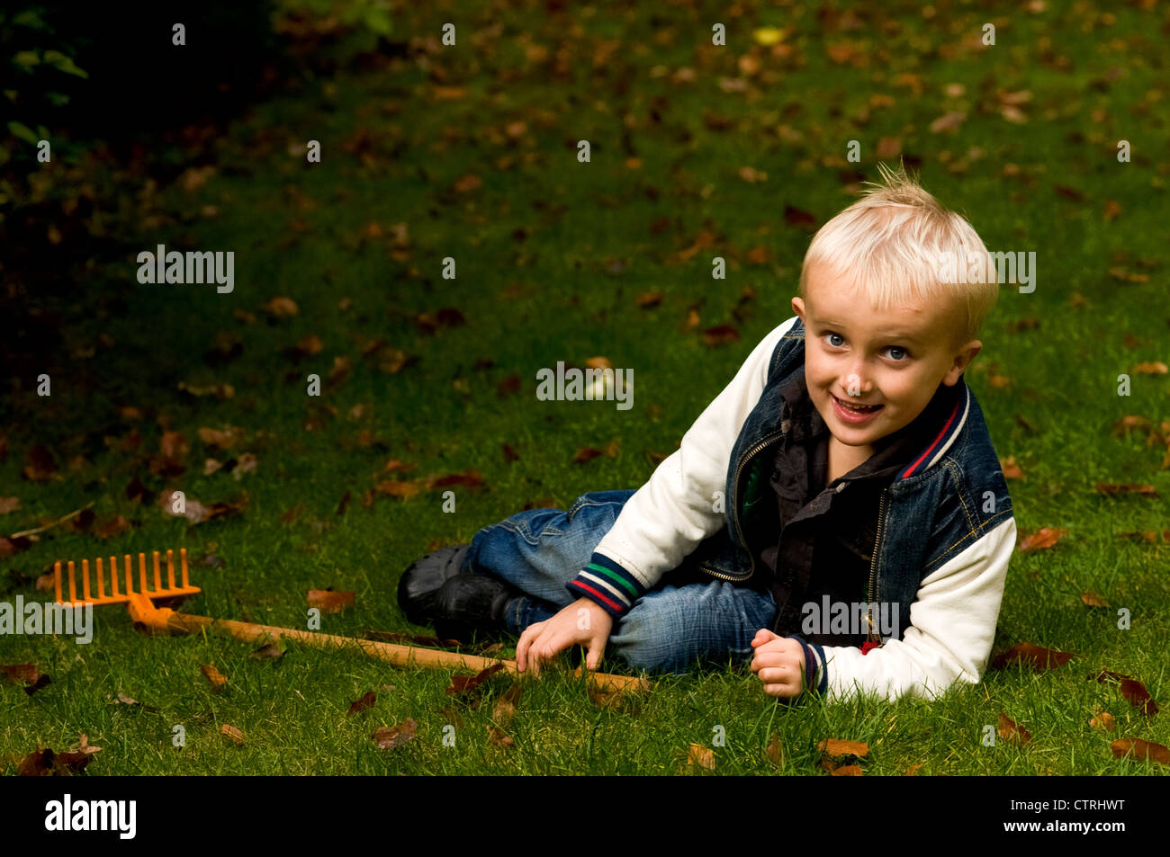 Kid With Rake Children gardening with rake hi-res stock photography and images - Alamy