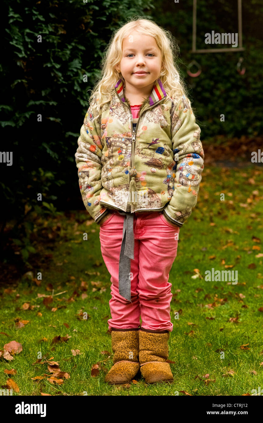 Little blond girl posing for photograph Stock Photo