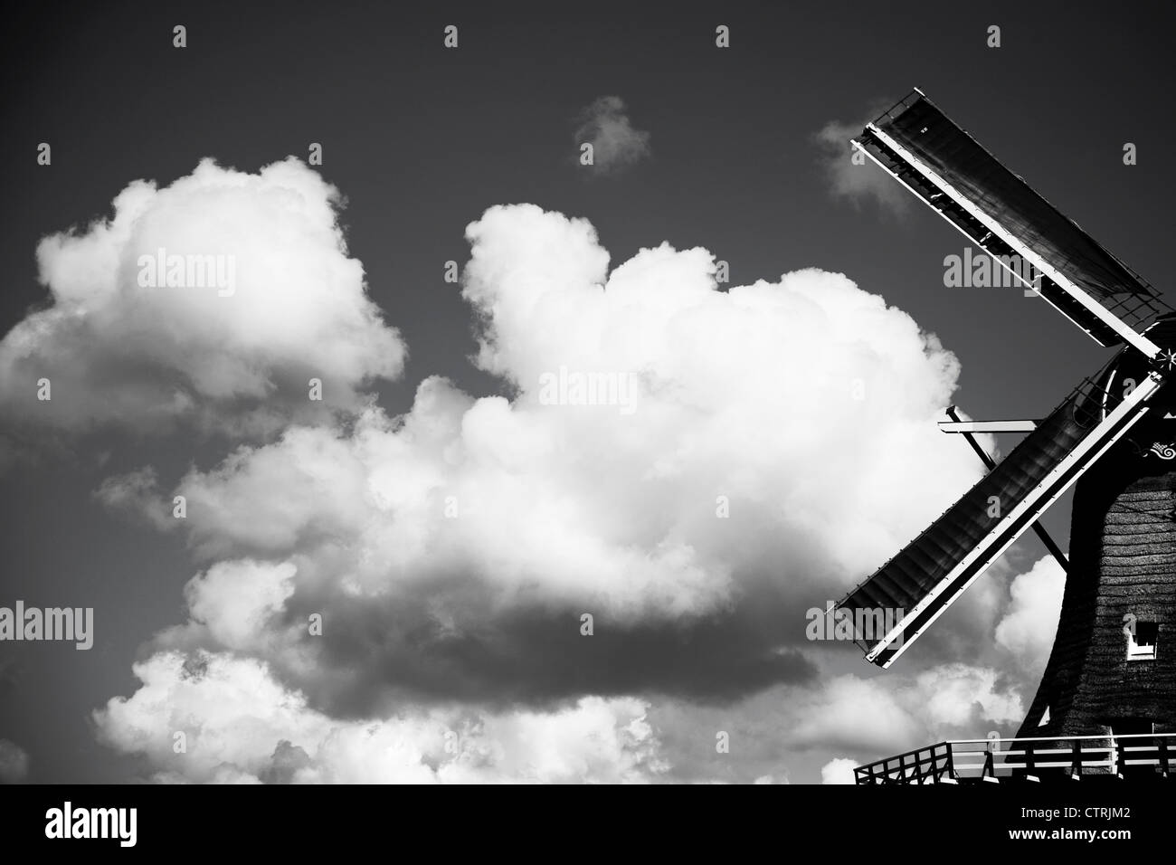 Traditional windmill with white clouds in the City of Leiden - Netherlands Stock Photo