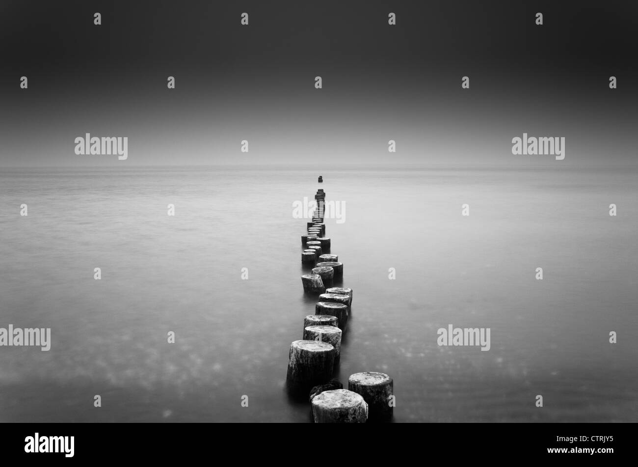 Old wooden groynes on a beach on the Baltic Sea Stock Photo