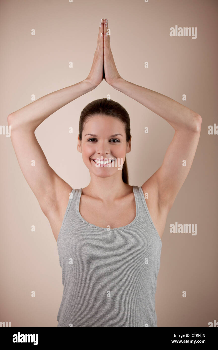 A young woman practicing yoga, tree pose Stock Photo - Alamy