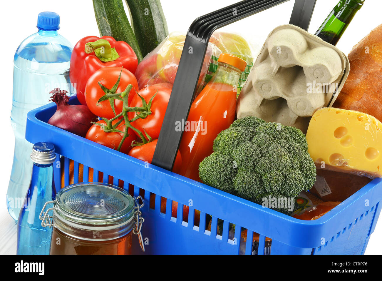 Grocery in shopping basket isolated on white Stock Photo Alamy