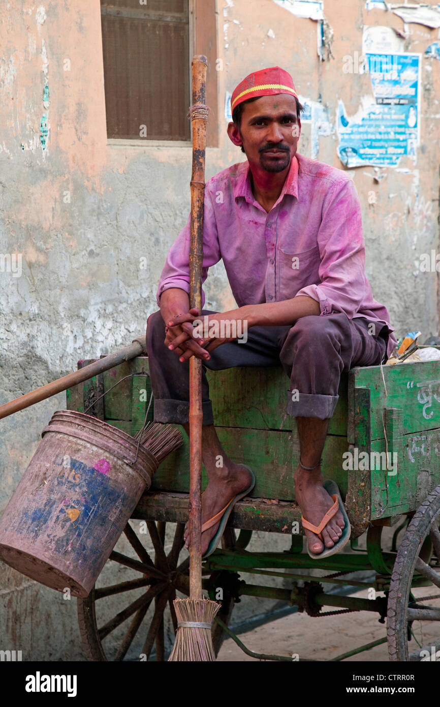 Indian garbage man on wooden cart in Vrindavan, Uttar Pradesh, India Stock Photo