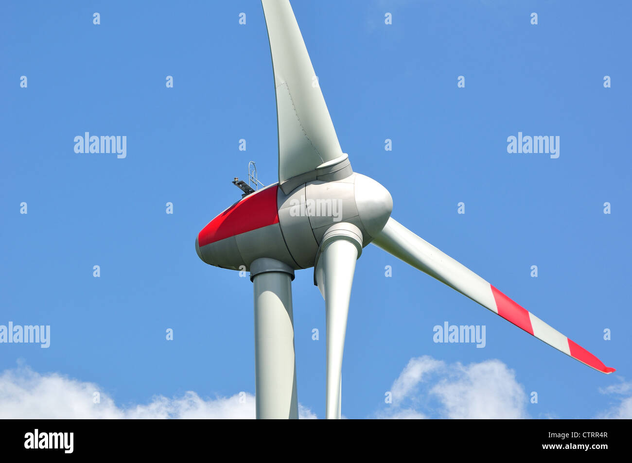 Wind turbine against blue sky Stock Photo - Alamy