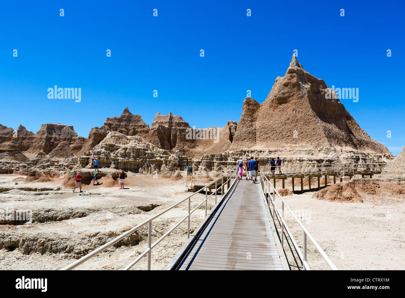 Tourists on boardwalk of the Door Trail, Badlands National Park, South Dakota, USA Stock Photo