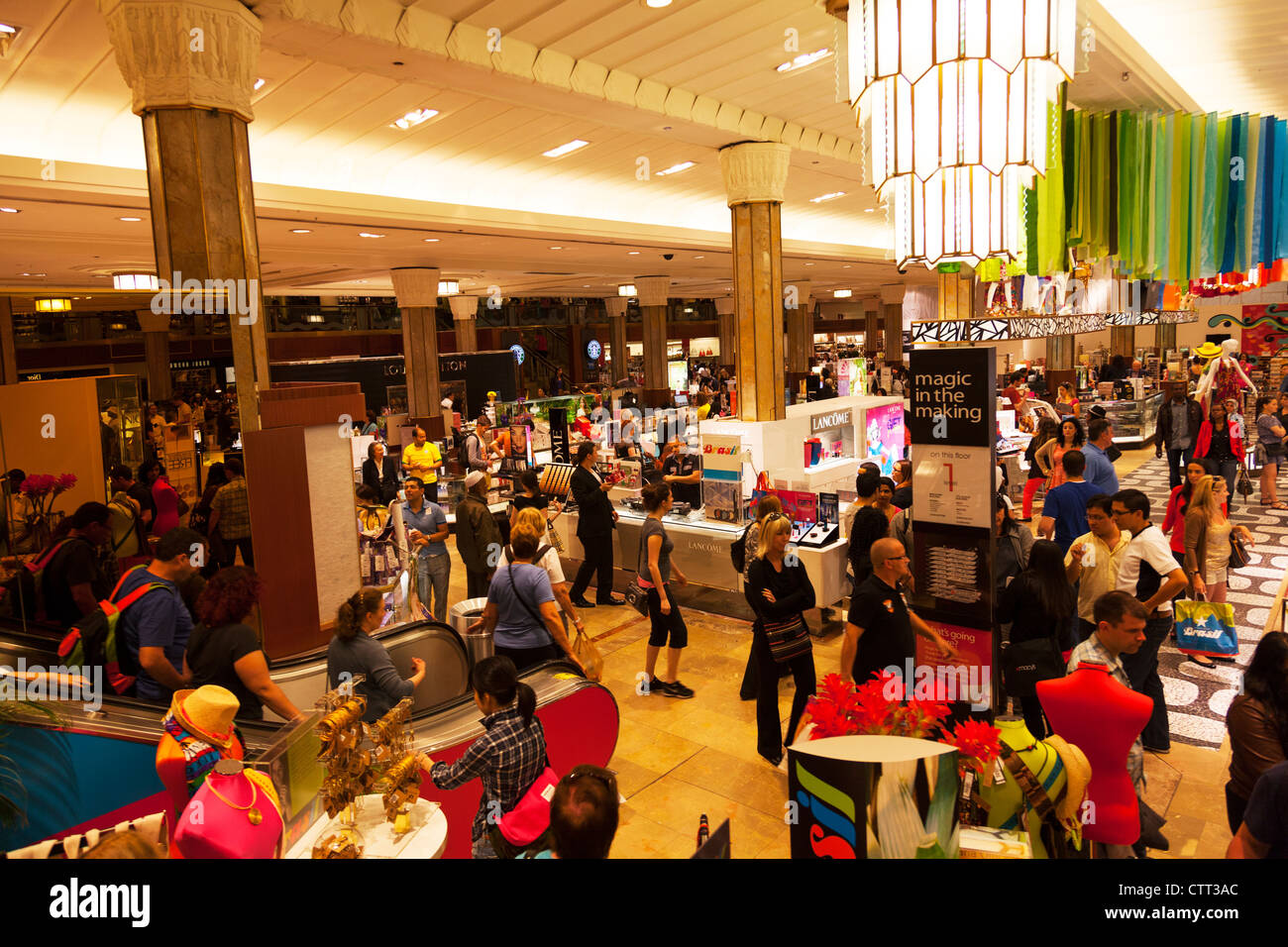 Shoppers shopping inside Macys department store New York City Manhattan interior iconic shop Stock Photo