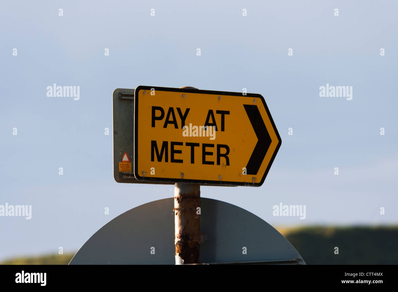 a pay at the meter sign Stock Photo