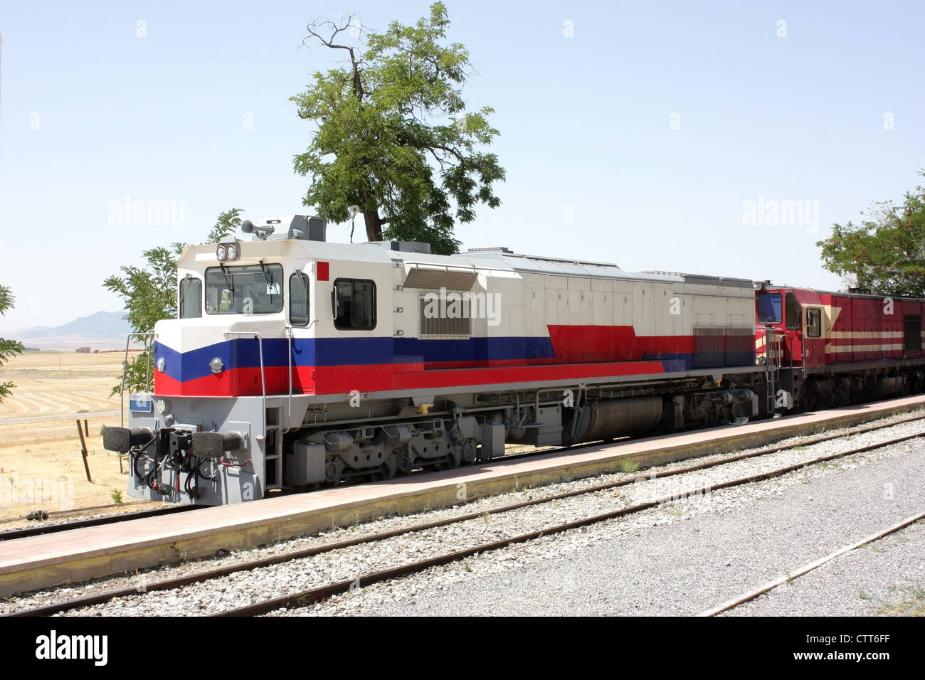Two diesel in the station. Trees on background Stock Photo Alamy