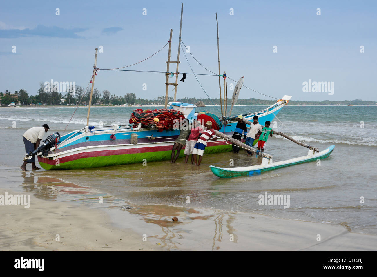 fishermen and outrigger fishing boat oru or sea canoe on