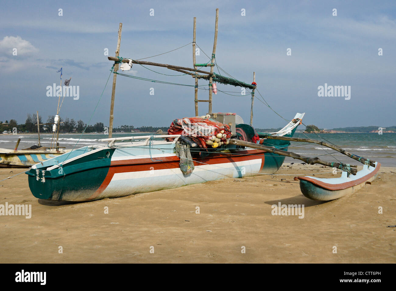 Outrigger fishing boats (oru or sea canoes) on beach, Weligama, Sri Lanka  Stock Photo - Alamy