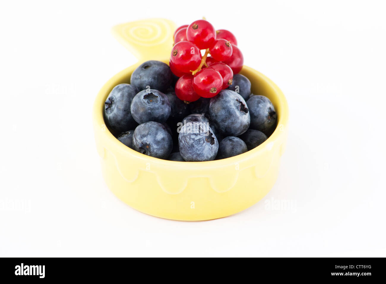 Blueberries and currants on white background Stock Photo