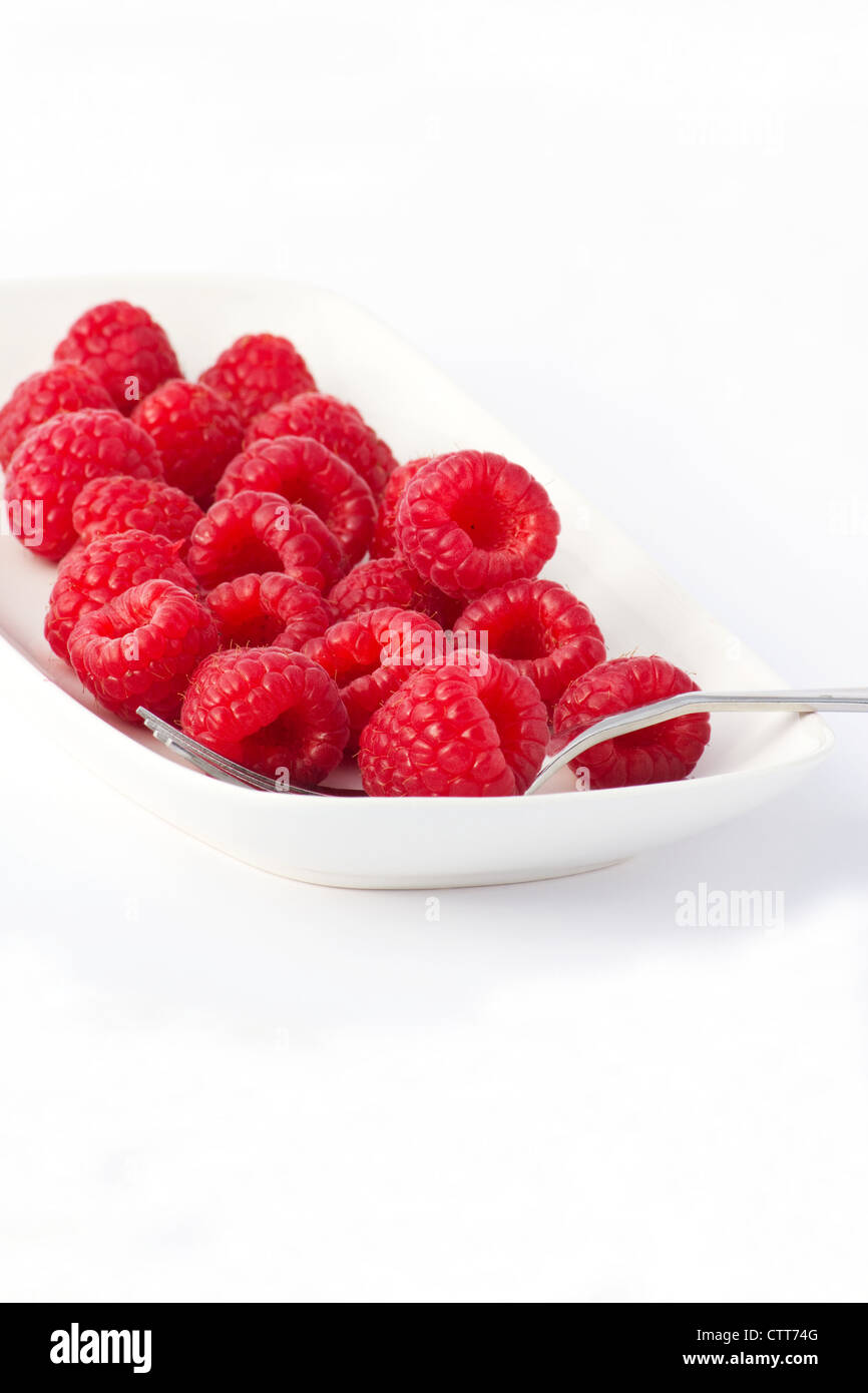 Red Raspberries on white background Stock Photo
