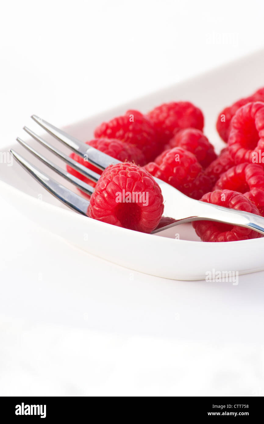Red Raspberries on white background Stock Photo